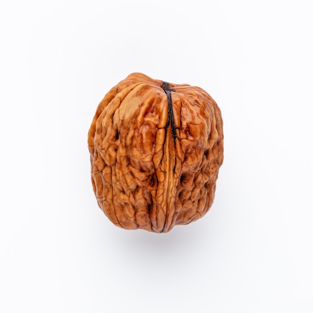 Organic walnuts isolated on white background.