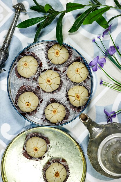 Oriental Algerian sweet cookies named Touma in Arabic language mean garlic in english in old metal b