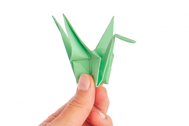 Origami crane on white surface