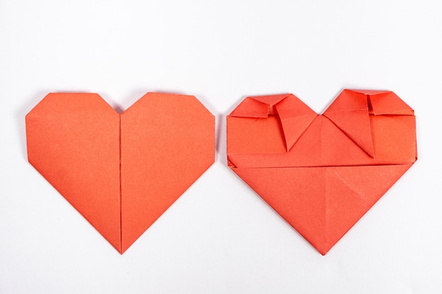 Origami for Valentine's Day heart made of paper on a white background do it yourself