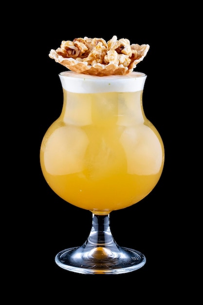 Original cocktail with orange and popcorn on a dark background