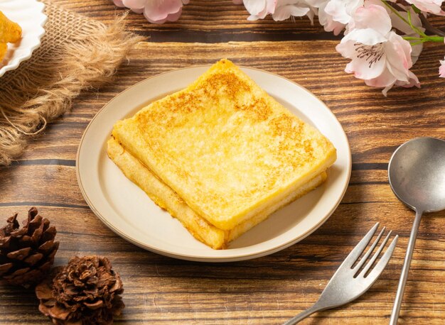 Original French Toast in dish side view on wooden table taiwan style food