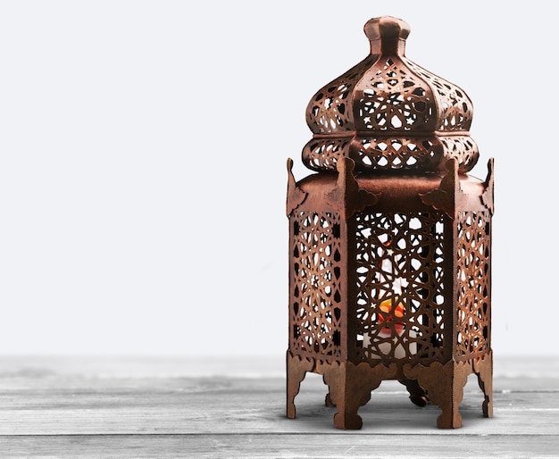 Ornamental Arabic lantern on wooden table