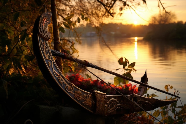 Photo ornate bow and quiver by a lake at dawn bow arrow image photography