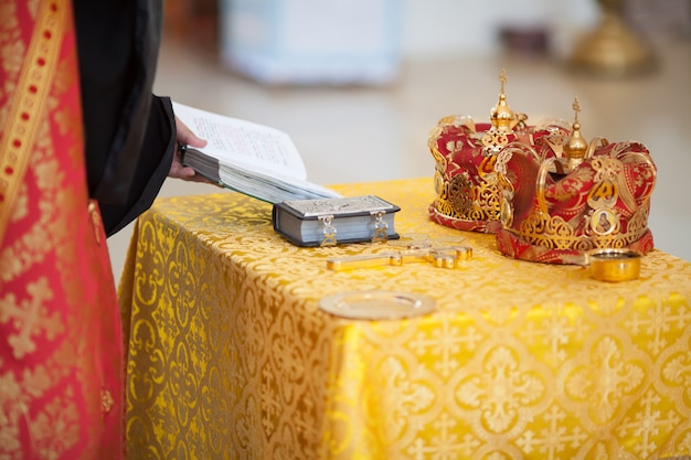 Orthodox Church wedding paraphernalia - cross, bible and crowns