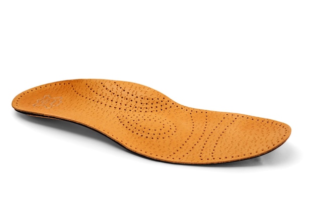 Orthopedic insole on a white background treatment of flat feet