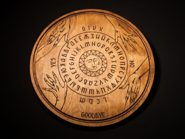 Ouija Board yellow on a black background