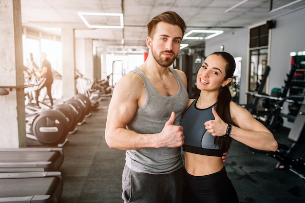 ouple standing in the sport club's training room together