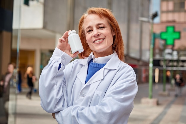 Our knowledgeable pharmacist is here to help She's holding medication