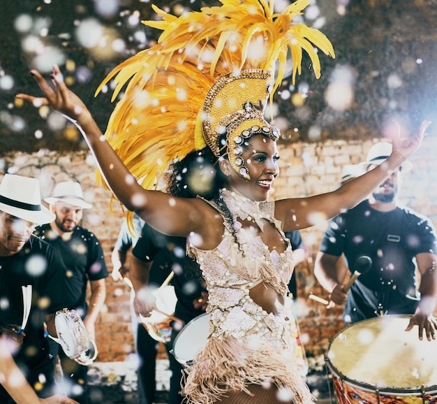 Our night to shine Cropped shot of a beautiful samba dancer performing in a carnival with her band