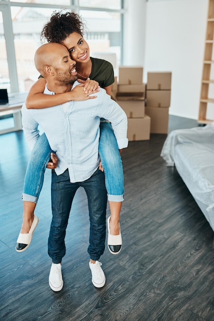 Our relationship moved to a whole new level Shot of a young couple having fun while moving house