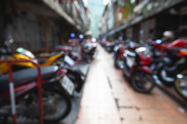 Out of focus background with a lot of parked scooters