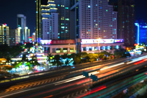 Out of focus. Blurred lights of the modern night city captured with the long exposure