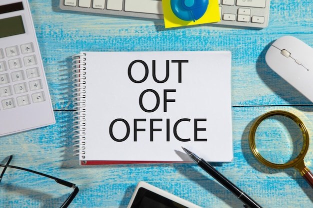 Out Of Office on notepad Business concept