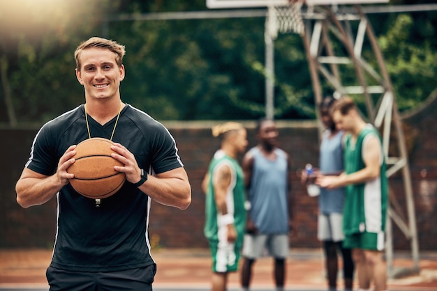 Outdoor basketball court coach and happy man portrait training collaboration and sports for college athlete team professional player and fitness group Proud smile and teaching expert game skills