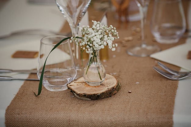 Outdoor catering dinner at the wedding with homemade garnishes decoration