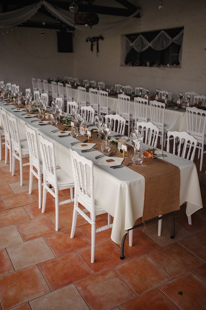 Outdoor catering dinner at the wedding with homemade garnishes decoration