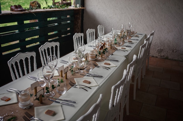 Outdoor catering dinner at the wedding with homemade garnishes decoration