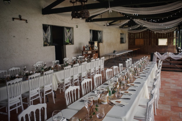 Outdoor catering dinner at the wedding with homemade garnishes decoration