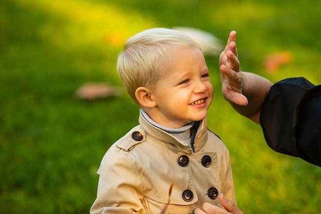 Outdoor fashion portrait of little boy kid.