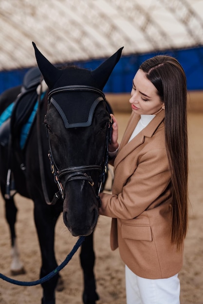 Outdoor hobby horse riding on a ranch Portrait of young lady with horse