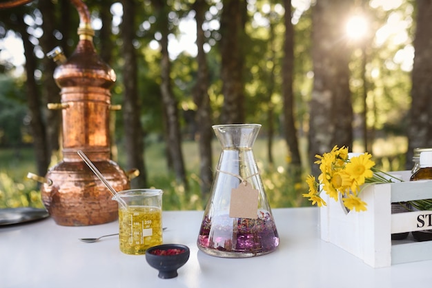 Outdoor natural cosmetics laboratory in the forest with essential oils