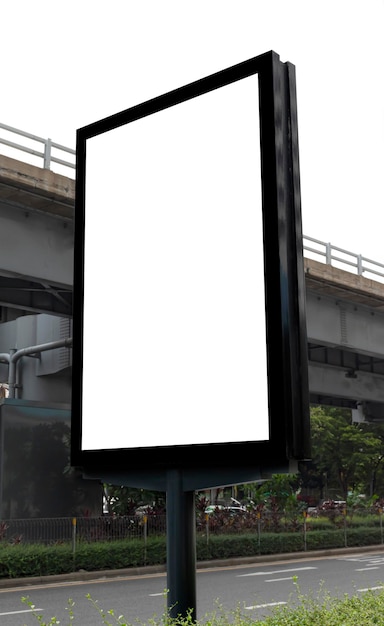 Outdoor pole billboard with mock up white screen on city view background and clipping path