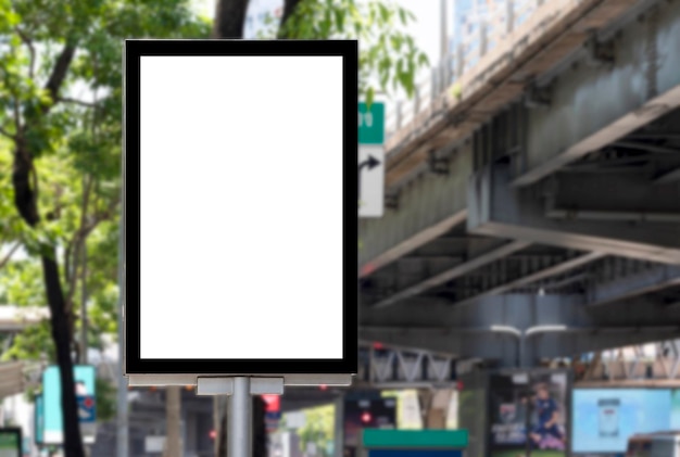 Outdoor pole billboard with mock up white screen on footpath and clipping path