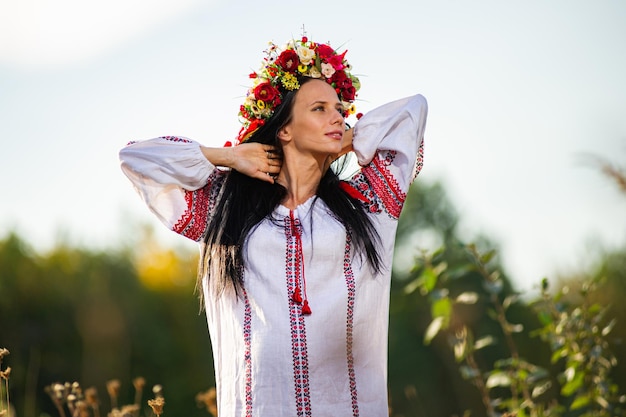 Outdoor portrait of beautiful pregnant Ukrainian woman