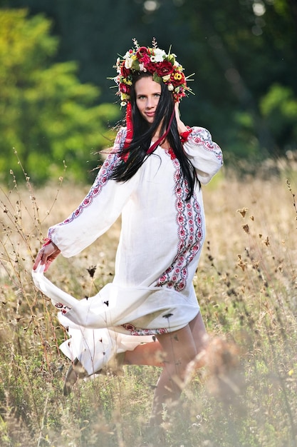 Outdoor portrait of beautiful pregnant Ukrainian woman