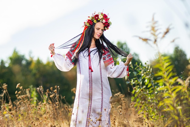 Outdoor portrait of beautiful pregnant Ukrainian woman