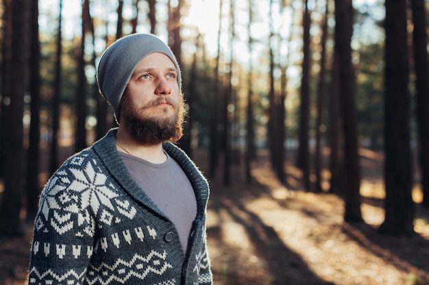 Outdoor portrait of handsome bearded man