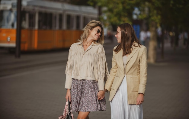 Outdoor portrait of happy caucasian young women enjoying good day pretty young girls having fun outd