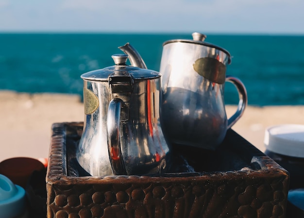 Outdoor pots for making Arabic Turkish coffee at Mediterranean sea Alexandria Egypt