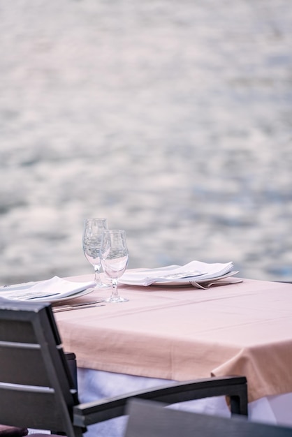 Outdoor restaurant table by the sea