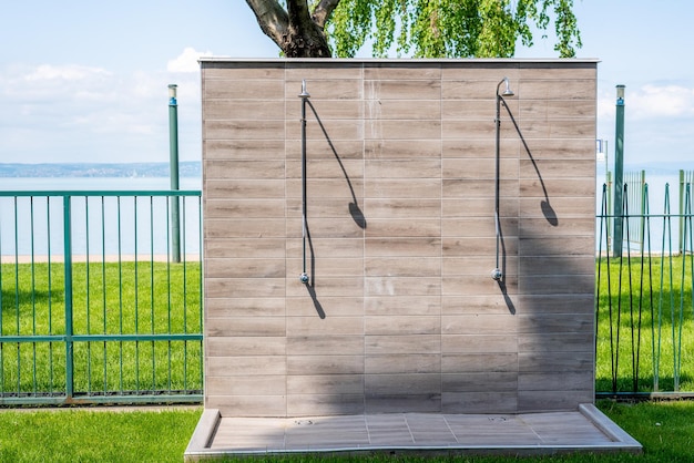 Outdoor shower on the beach Trendy modern minimalist design outside exterior elements