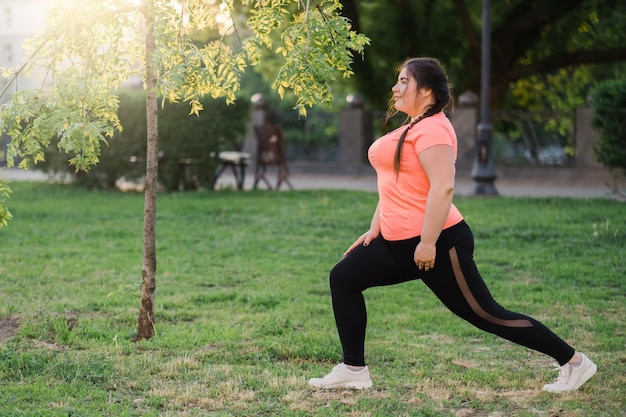 Outdoor sport fat burning overweight woman park