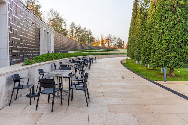 Outdoor table and chairs near the wall at coffee shop,