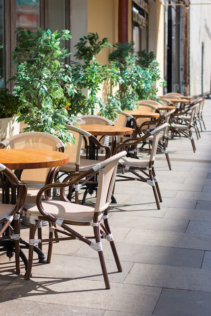 Outdoor tables in cafes. Summer veranda of the restaurant