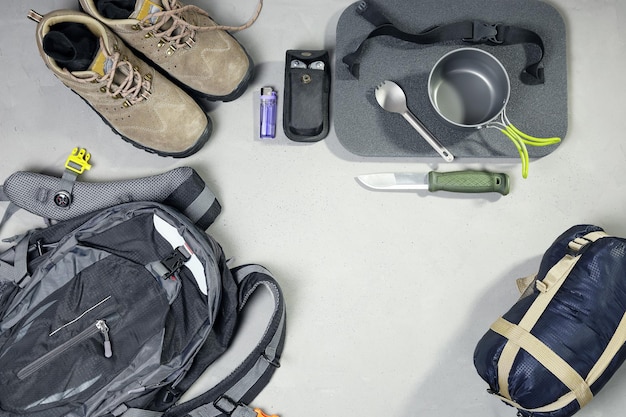 Outdoor travel equipment planning for camping trip in flat lay