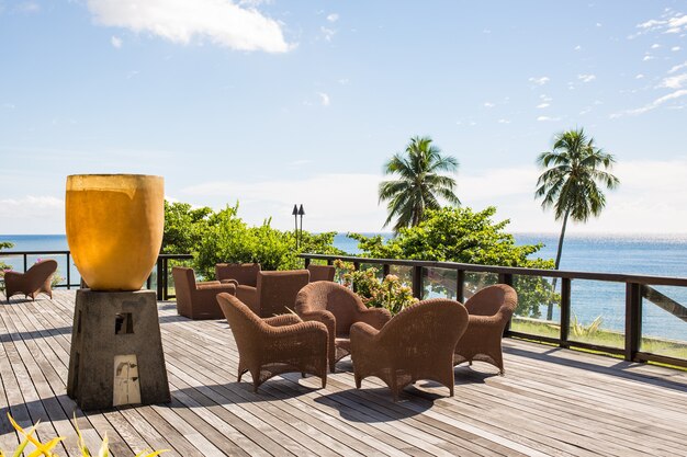 Outdoor wicker chairs on a sunny day