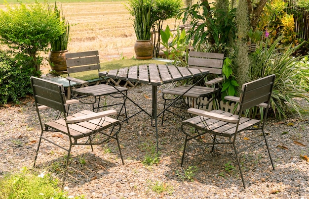 Outdoor wooden chair and table at lawn coffee shop