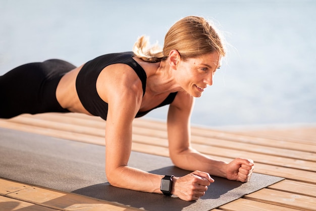 Outdoor Workout Sporty Middle Aged Woman Doing Elbow Plank Exercise