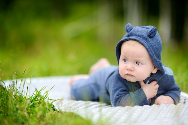 Outdoors portrait of sweet little baby boy 