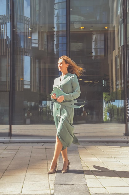 A outside business girl and office with phone notepad and pen