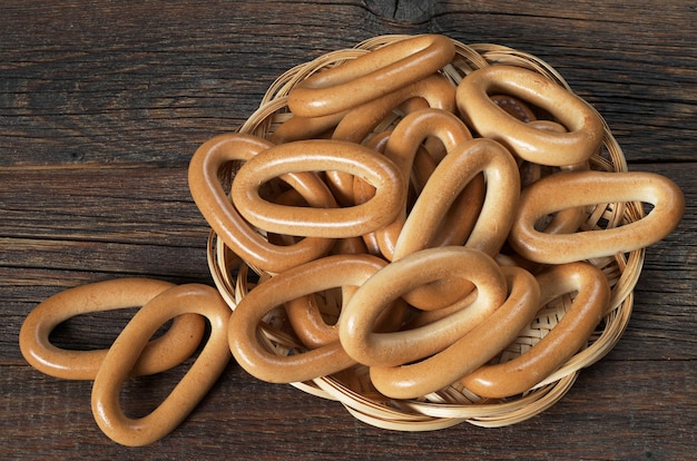 Oval bagels on old wooden background