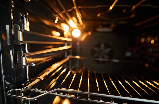 oven in the oven closeup Inside a new empty electric open oven with light