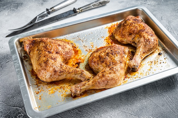 Oven Roasted barbeque chicken legs in baking dish