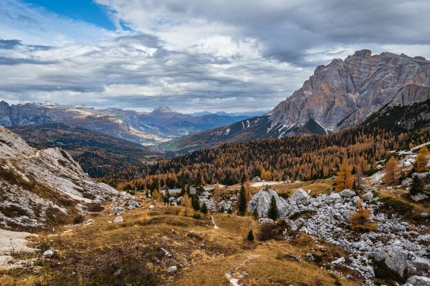 Overcast morning autumn alpine Dolomites mountain scene Peaceful Valparola Pass view Belluno Italy