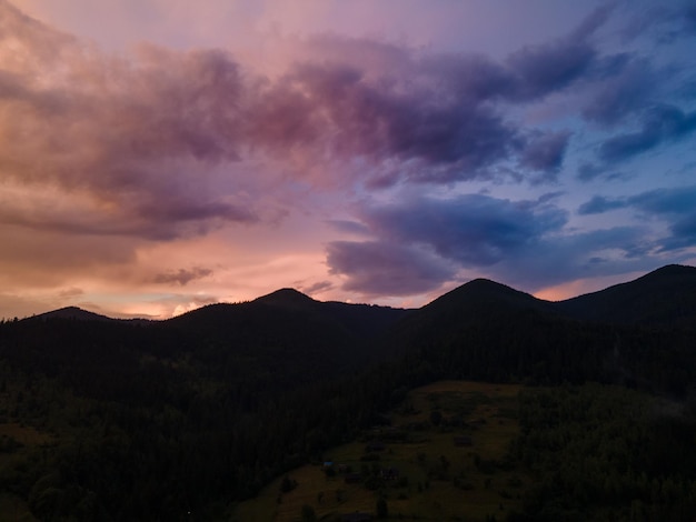 Overcast sunset above mountains